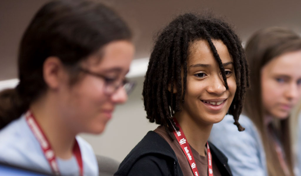 rhianna grimes looking at fellow camper's project